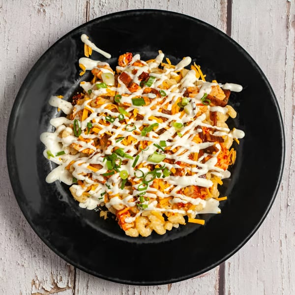 True Grit American Bistro's breakfast mac and cheese, topped with bacon, cheese, ranch, and green onions.