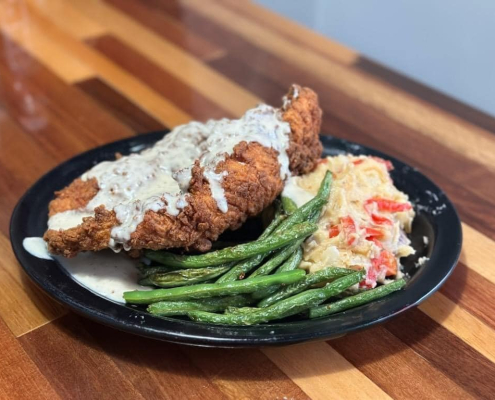 Serving dinner in Pensacola weekly special Fried Chicken with Gravy